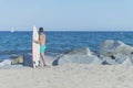 Young attractive surfer holding his surfboard at the beach Royalty Free Stock Photo