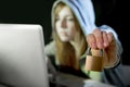 young attractive teen woman wearing hoodie hacking laptop cybercrime cyber crime concept