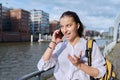 Young attractive teenage girl talking on mobile phone, outdoor Royalty Free Stock Photo