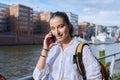 Young attractive teenage girl talking on mobile phone, outdoor Royalty Free Stock Photo