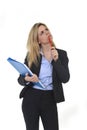 Young attractive and thoughtful business woman with blue folder and pen thinking about project Royalty Free Stock Photo