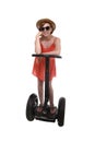 Young attractive tourist woman in chic summer dress smiling happy riding electrical segway Royalty Free Stock Photo