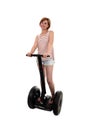 Young attractive tourist woman in summer shorts smiling happy riding electrical segway