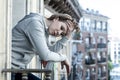 Young attractive unhappy depressed lonely woman crying looking in stress on the balcony at home Royalty Free Stock Photo