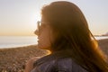 Young attractive woman on the beach at sunset time Royalty Free Stock Photo