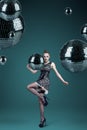 Young woman with disco balls Royalty Free Stock Photo