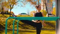 Young attractive woman doing exercises on parallel bars Royalty Free Stock Photo