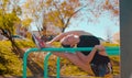 Young attractive woman doing exercises on parallel bars Royalty Free Stock Photo