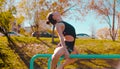 Young attractive woman doing exercises on parallel bars Royalty Free Stock Photo