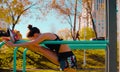 Young attractive woman doing exercises on parallel bars Royalty Free Stock Photo
