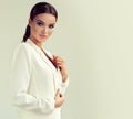 Young attractive woman dressed in a white suit jacket. Makeup and cosmetology. Royalty Free Stock Photo