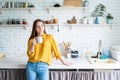 Attractive woman drinking tea in her kitchen Royalty Free Stock Photo