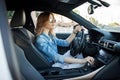 Young attractive woman driving her car. Portrait of a successful business woman. Royalty Free Stock Photo