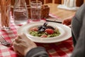 Young attractive woman eating meal set of spaghetti, green spinach pasta. Still life, eating out in restaurant Royalty Free Stock Photo