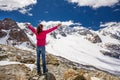 Young attractive woman enjoying the stunning view of Morteratsch glacier from Diavolezza mountain, canton G