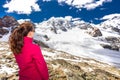 Young attractive woman enjoying the stunning view of Morteratsch glacier from Diavolezza mountain, canton G