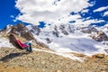 Young attractive woman enjoying the view of Morteratsch glacier
