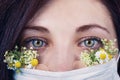 Young attractive woman in floral face mask