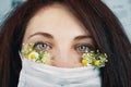 Young attractive woman in floral face mask