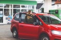 Young attractive woman gets out of her car by gas station to refill car with petrol or gas. People refuel gasoline Royalty Free Stock Photo