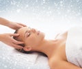 Young attractive woman getting massaging treatment on the snow Royalty Free Stock Photo