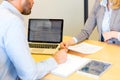 Young attractive woman giving resume during job interview