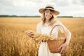 Young attractive woman and golden wheat field. Royalty Free Stock Photo