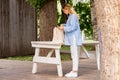 Young and attractive woman holding cotton blank white canvas bag at modern park. Eco friendly concept .eco biodegradable Royalty Free Stock Photo