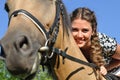 Young attractive woman horseback riding