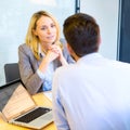 Young attractive woman during job interview