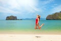 Young attractive woman jumping on the sea beach Royalty Free Stock Photo