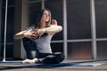 A young attractive woman with light hair practices yoga. Yoga, fitness, healthy lifestyle Royalty Free Stock Photo