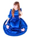 Young attractive woman in a long blue evening dress Royalty Free Stock Photo