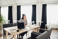 Young attractive woman looking away thoughtfully with her laptop opened. Royalty Free Stock Photo