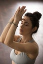 Young attractive woman making namaste gesture, studio background Royalty Free Stock Photo