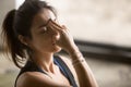 Young attractive woman in nadi shodhana pranayama pose, studio b Royalty Free Stock Photo