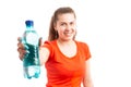 Young attractive woman offering bottle of water Royalty Free Stock Photo