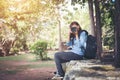 Young attractive woman photographer tourist with backpack coming