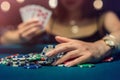young attractive woman playing poker at table with stacks of chips and cards Royalty Free Stock Photo