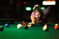 Young attractive woman playing pool in bar Royalty Free Stock Photo