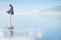 Young attractive woman posing at amazing New Zealand beach