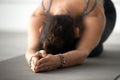 Young attractive woman practicing yoga, doing meditation exercis Royalty Free Stock Photo