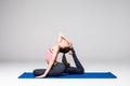 Young attractive woman practicing yoga, standing in different yoga exercise, wearing sportswear isolated on grey background. Serie Royalty Free Stock Photo