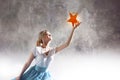 Young attractive woman reaching for the star. Take a star from the sky, dreams and plans, concept Royalty Free Stock Photo