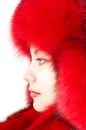 Young attractive woman in red fur-cap Royalty Free Stock Photo