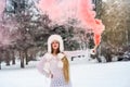 Young and attractive woman with red smoke bomb Royalty Free Stock Photo