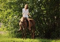 Young attractive woman relaxing horseback Royalty Free Stock Photo