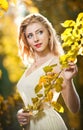 Young attractive woman in a romantic autumn day