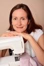 Young attractive woman sewing on machine Royalty Free Stock Photo