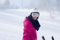 Young attractive woman, skiing in Austrian ski resort on a sunny day Royalty Free Stock Photo